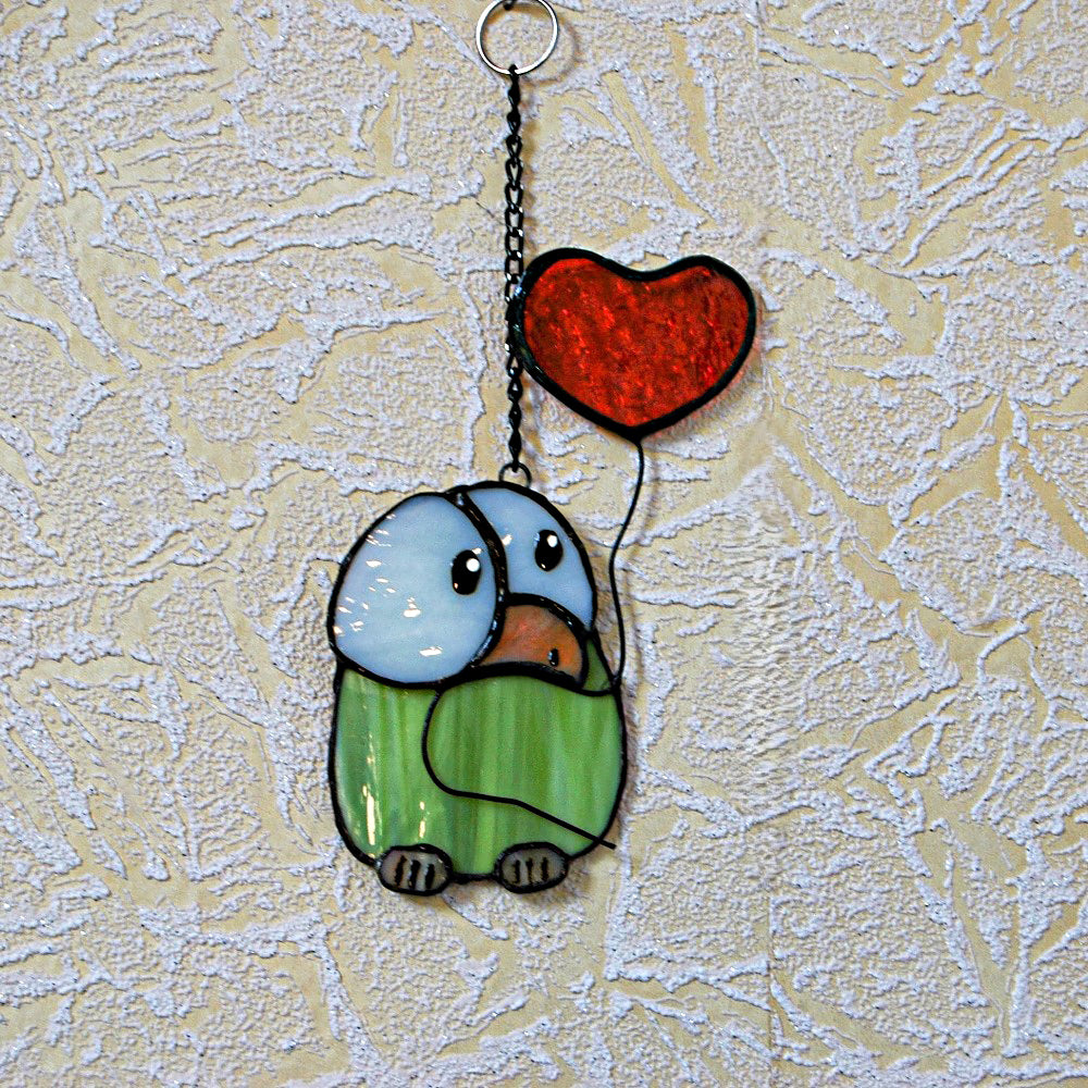 Chick stained glass with heart balloon