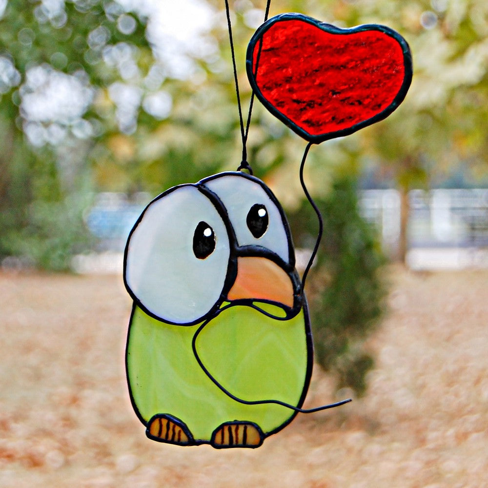 Chick stained glass with heart balloon