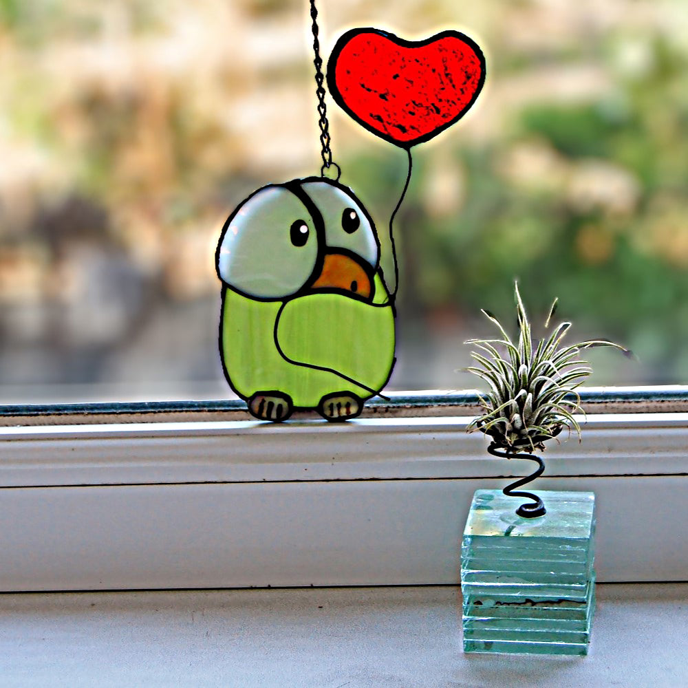 Chick stained glass with heart balloon