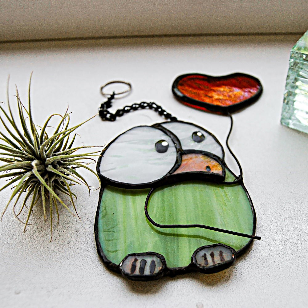 Chick stained glass with heart balloon