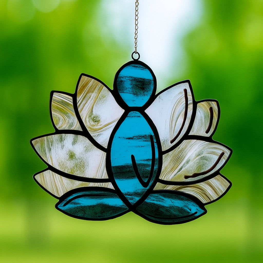 Stained glass suncatcher of a meditating figure in lotus pose with vibrant colors, spiritual glass art for mindfulness and inner peace