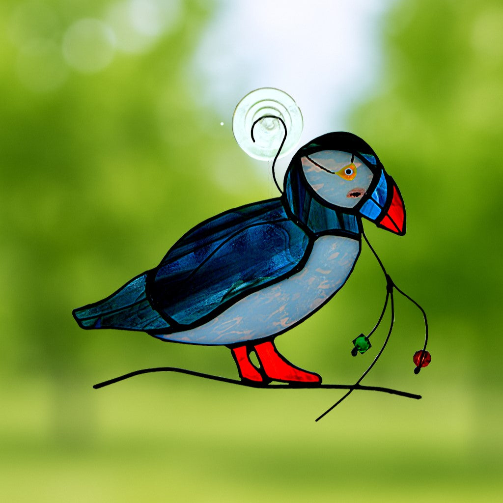 Stained glass puffin bird suncatcher with vibrant orange beak, handcrafted glass art inspired by coastal wildlife