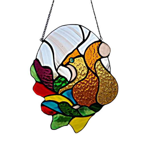 Stained glass window panel featuring a playful squirrel design with a mix of vibrant colors.
